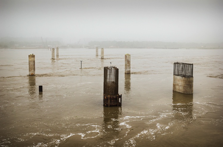 A bridge under construction on the river Yamuna in Majnu ka Tilla, New Delhi on June 17, 2013. Due to the rapid construction of bridges on the river, the very identity of Yamuna is threatened. New bridges are built, completely ignoring the dismal condition of the river and its ecosystem.